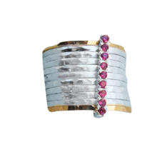 Load image into Gallery viewer, A bold and unique wide ring featuring two 9k solid yellow gold bands and eight 1mm solid sterling silver matte-textured rings. The design is accentuated by a vertical sterling silver bar adorned with sparkling ruby stones, creating a striking and elegant statement piece.
