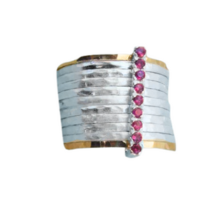 A bold and unique wide ring featuring two 9k solid yellow gold bands and eight 1mm solid sterling silver matte-textured rings. The design is accentuated by a vertical sterling silver bar adorned with sparkling ruby stones, creating a striking and elegant statement piece.
