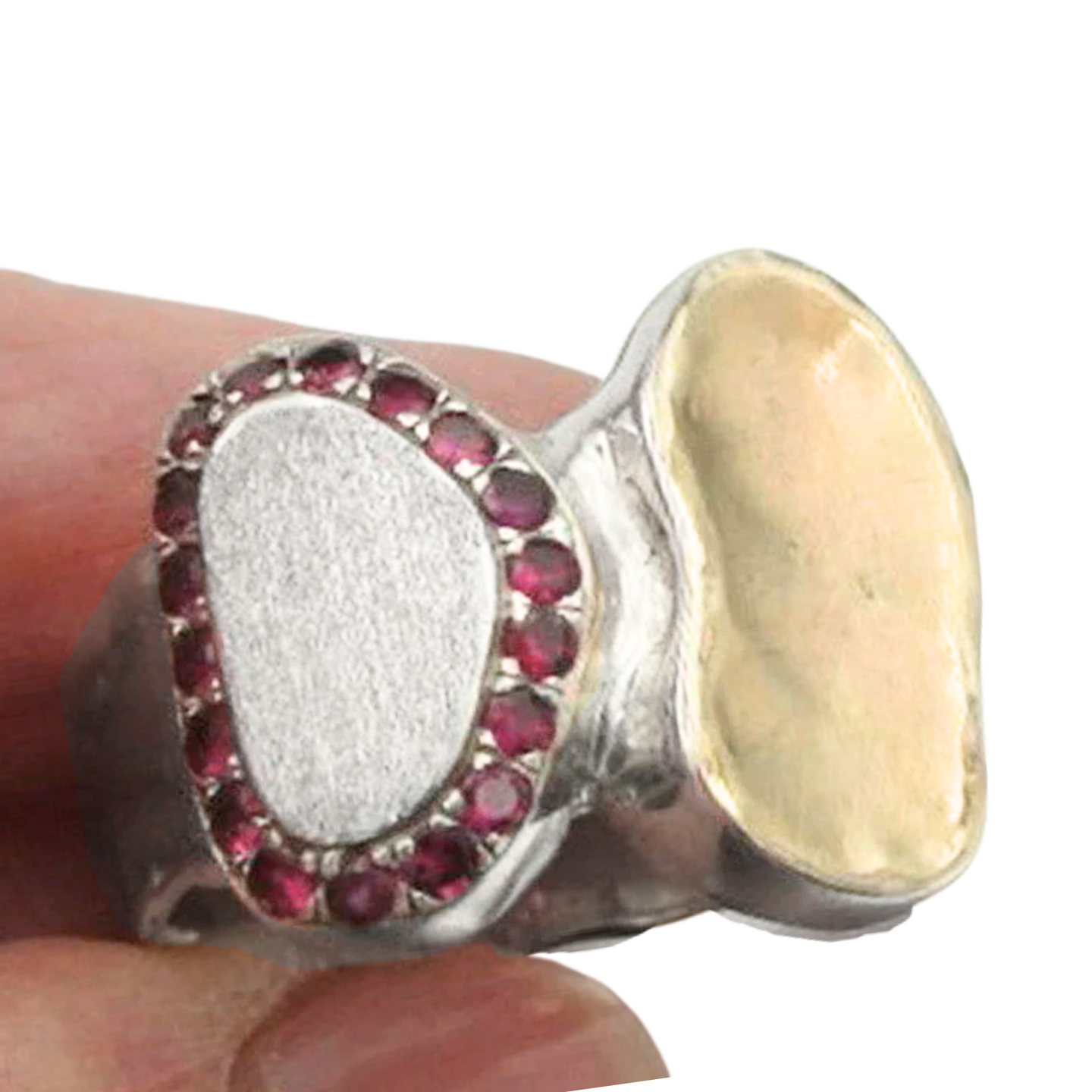 A handcrafted sterling silver and 9k yellow gold ring featuring a brushed silver surface, a polished gold accent, and a stunning border of sparkling natural ruby stones. This elegant and artistic design is a unique statement piece for any jewelry collection